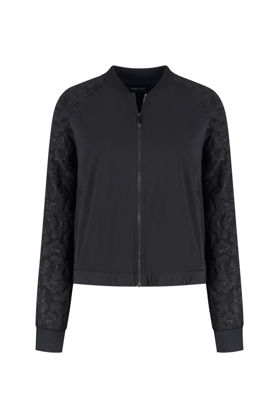 Lady Day reissjajacke Jaymi in zwart, lichtgewicht en waterbestendig, geschikt voor reizen en buitenactiviteiten.
