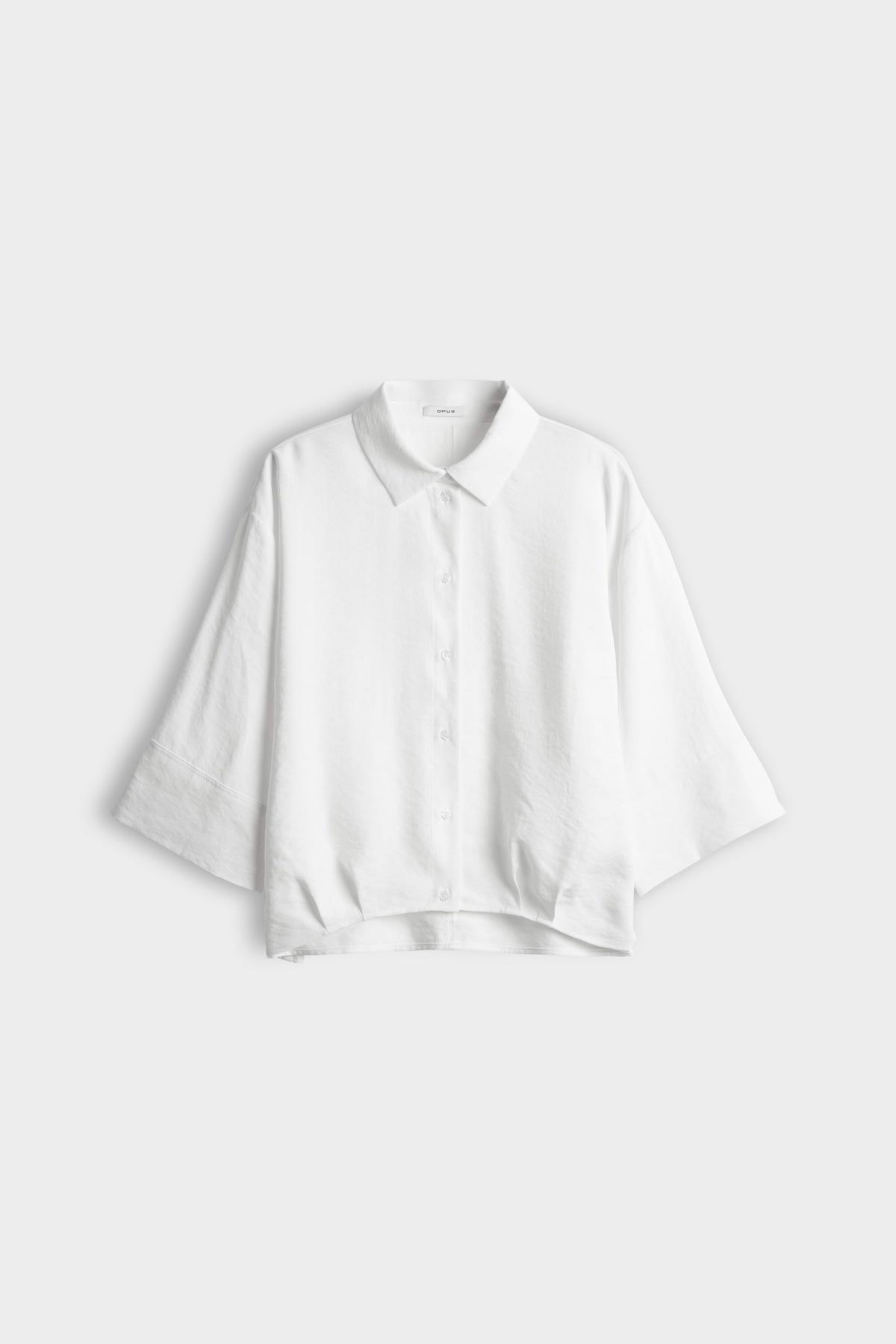 Lichte blauw fotori Milk blouse van Opus met driekwart mouwen en ronde hals, gedragen door een model.