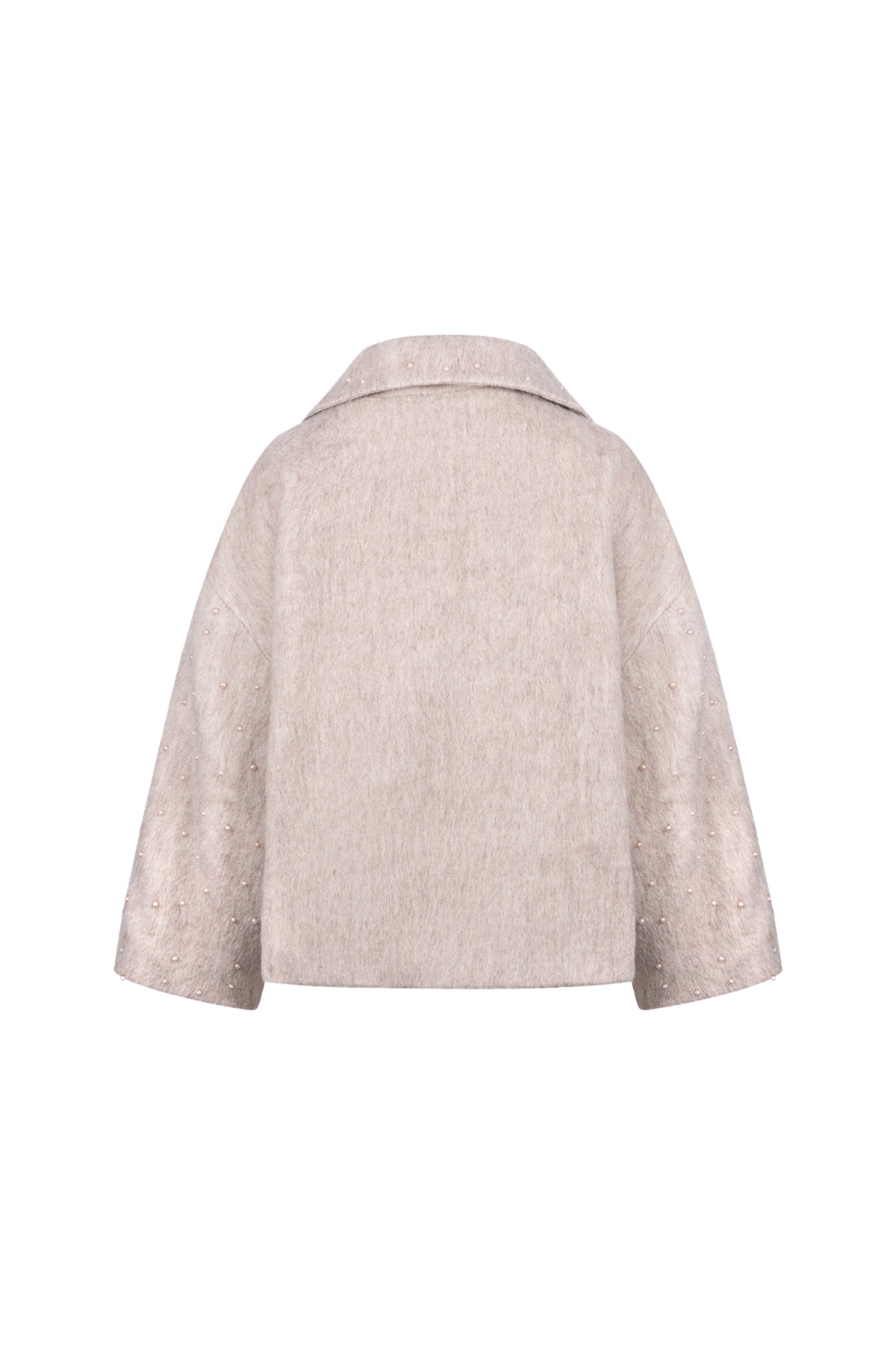 Donkerblauwe damesjas Nukus Danique Pearls Sand met parelversiering en rits, gedragen door een model.