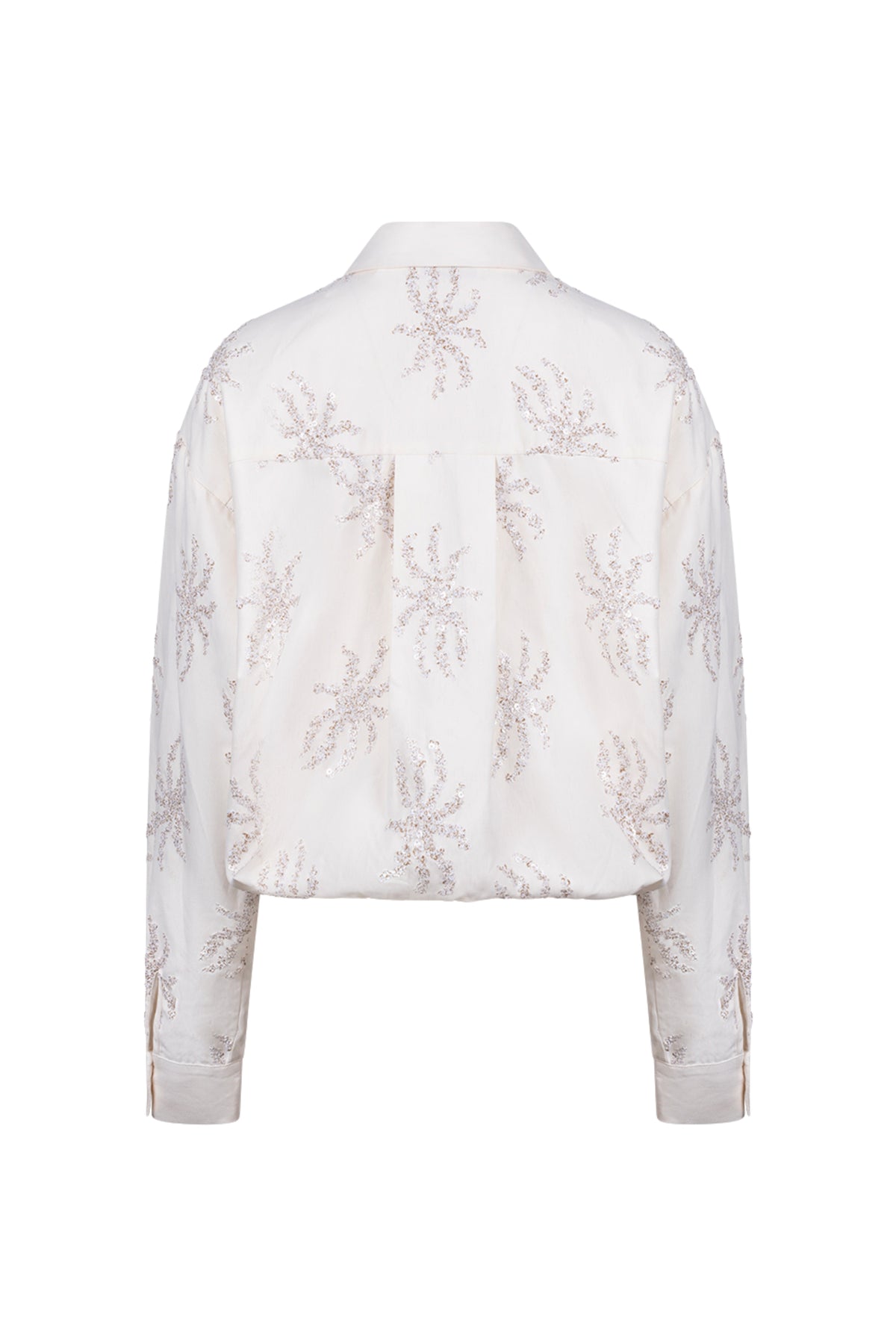 Offwhite Nukus blouse Aster met pailletten, elegante top met glanzende details en losse pasvorm, geschikt voor speciale gelegenheden.