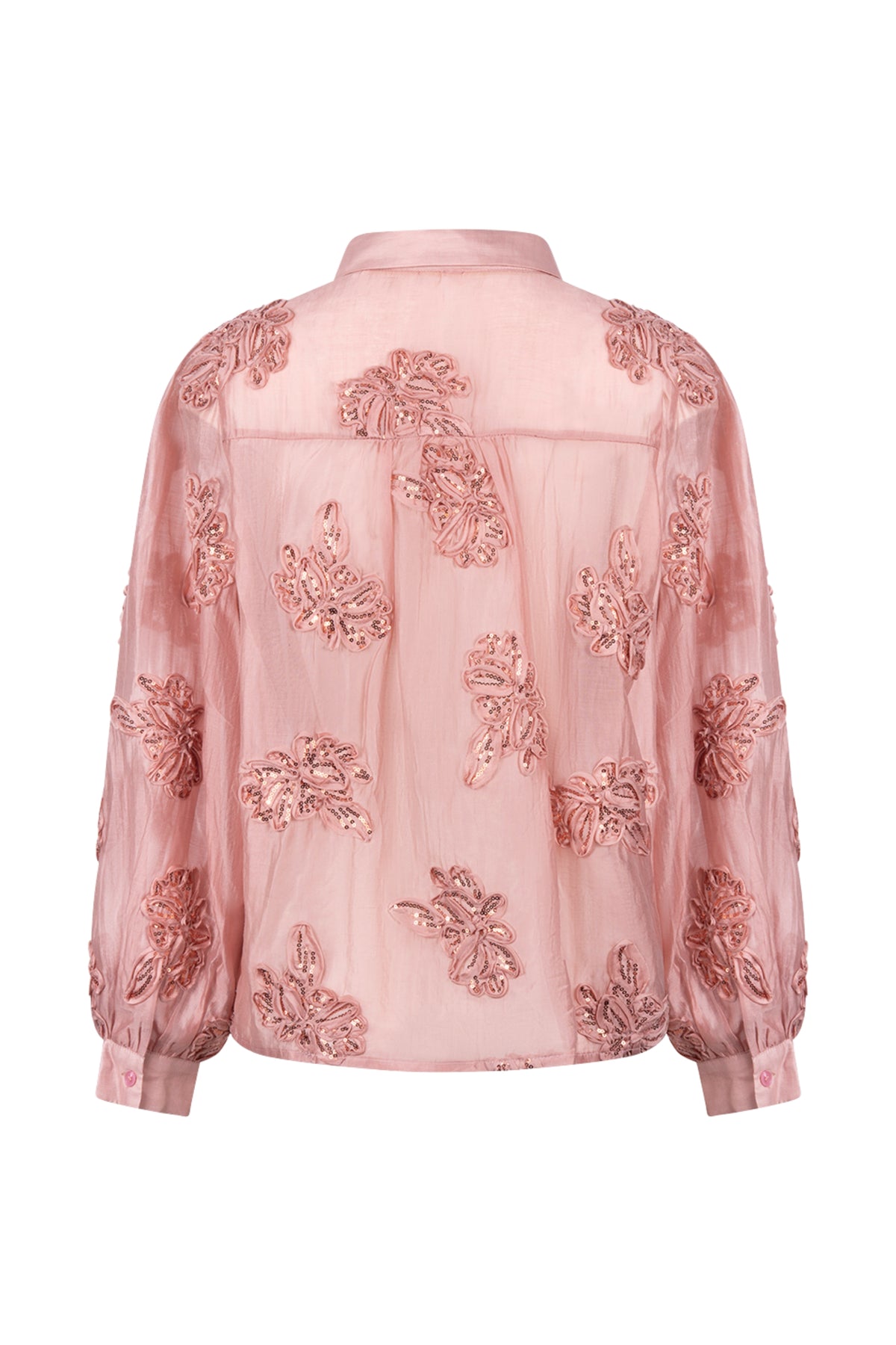 Nukus blouse Antonella Paillet Flower Rose met bloemenprint en pailletjes, getoond op een model.