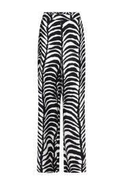Tramontana Palm Eclipse print broek in zwart, casual damesmode met opvallend patroon, model Lara, voor dagelijks gebruik.