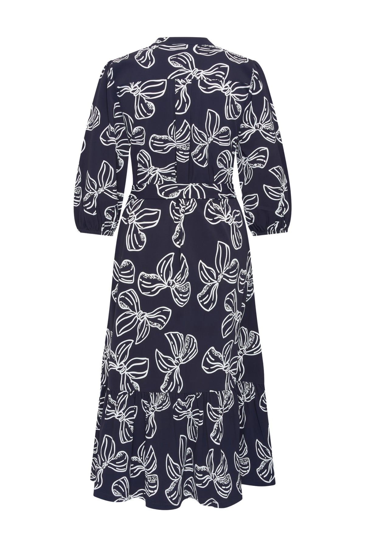Laarzen met print in navy en offwhite, stijlvolle reisjurk van Mi Piace met strikpatroon en elegante snit.