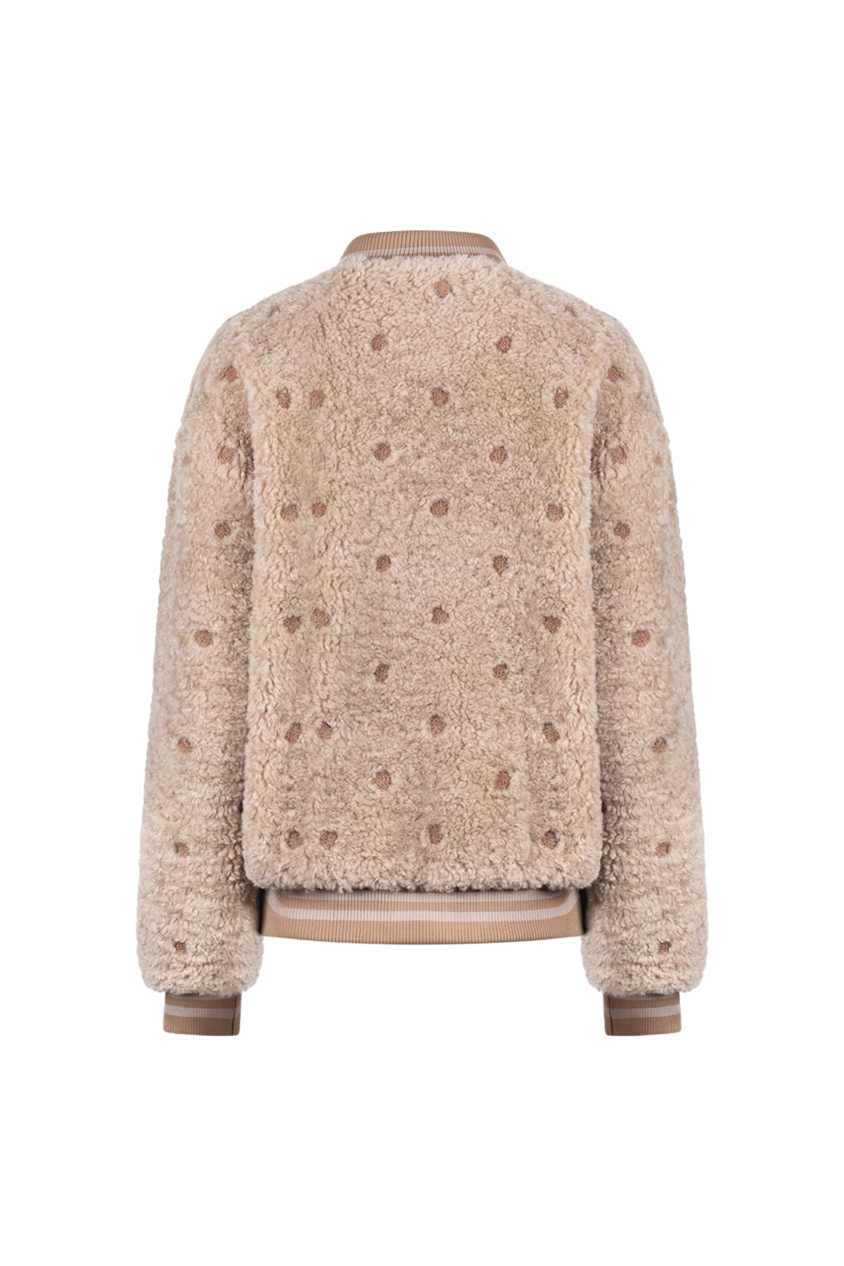 Nukus Henny Dots Sand jas met ronde stippen en capuchon, gedragen door model op witte achtergrond.