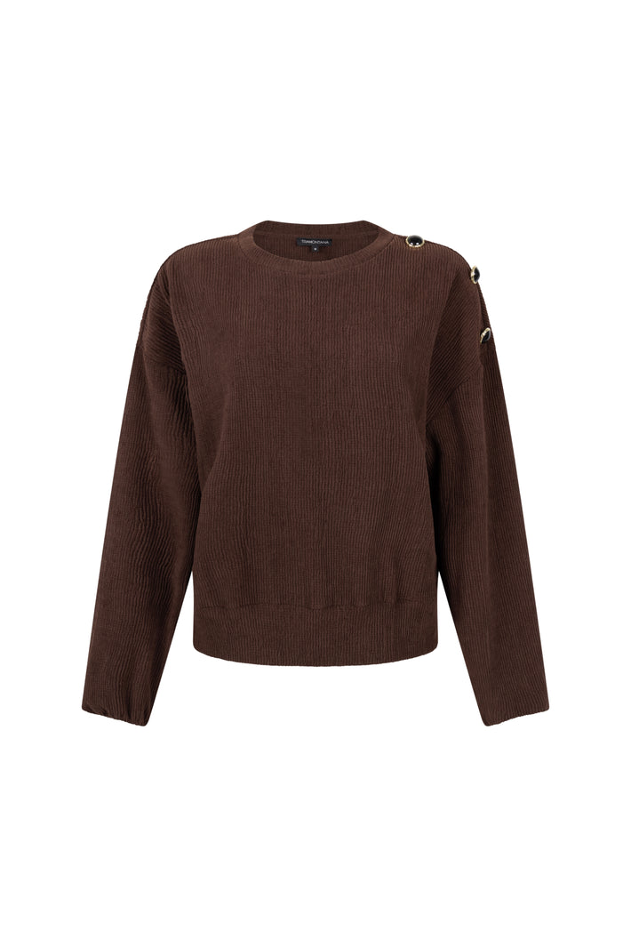 Donkere chocolade Tramontana trui met oversized schouders en los vallende pasvorm, getoond op een model.