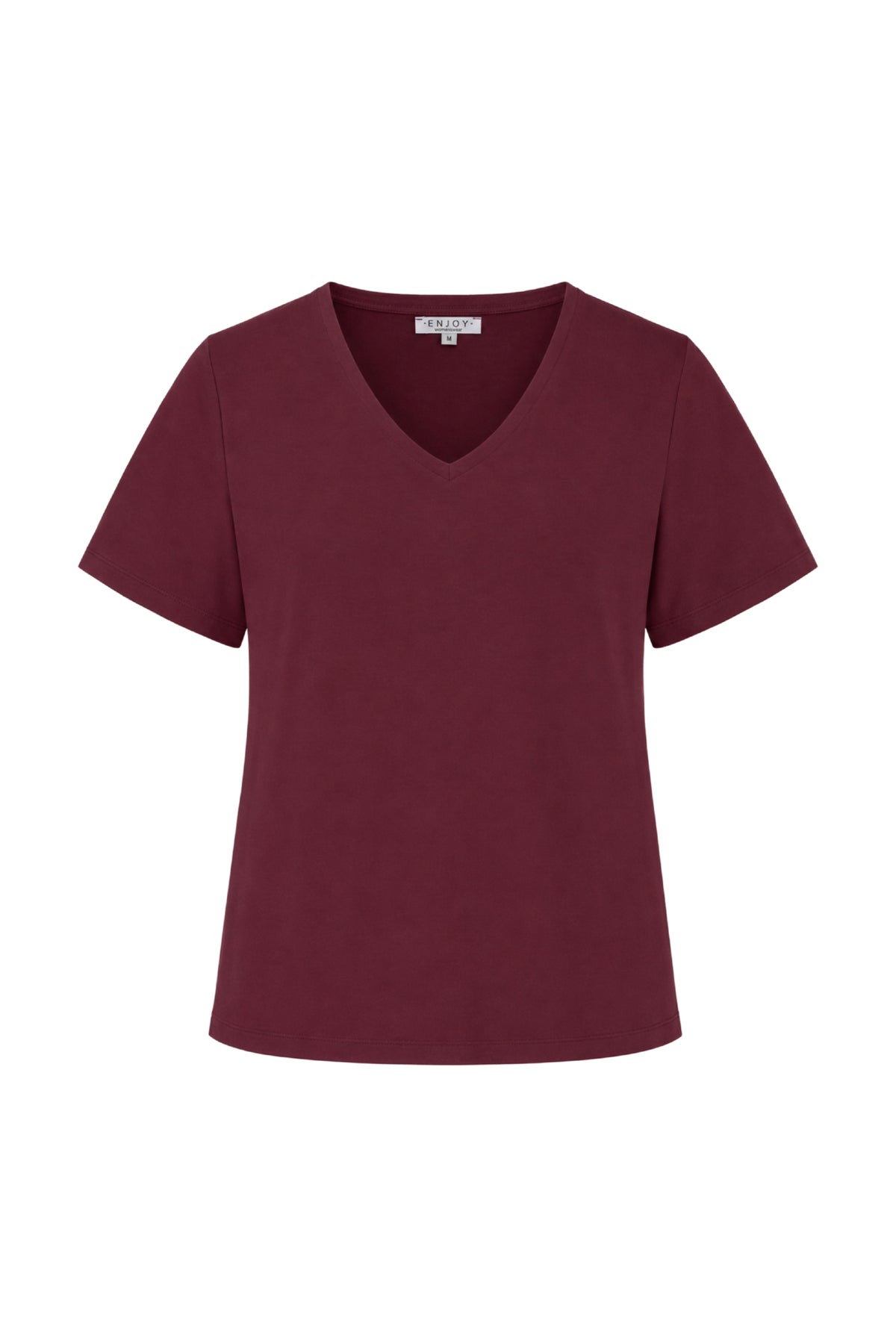Enjoy Top Uni Port 183207, wit en comfortabel, met een eenvoudige uitstraling en ronde hals, gedragen door Monique.