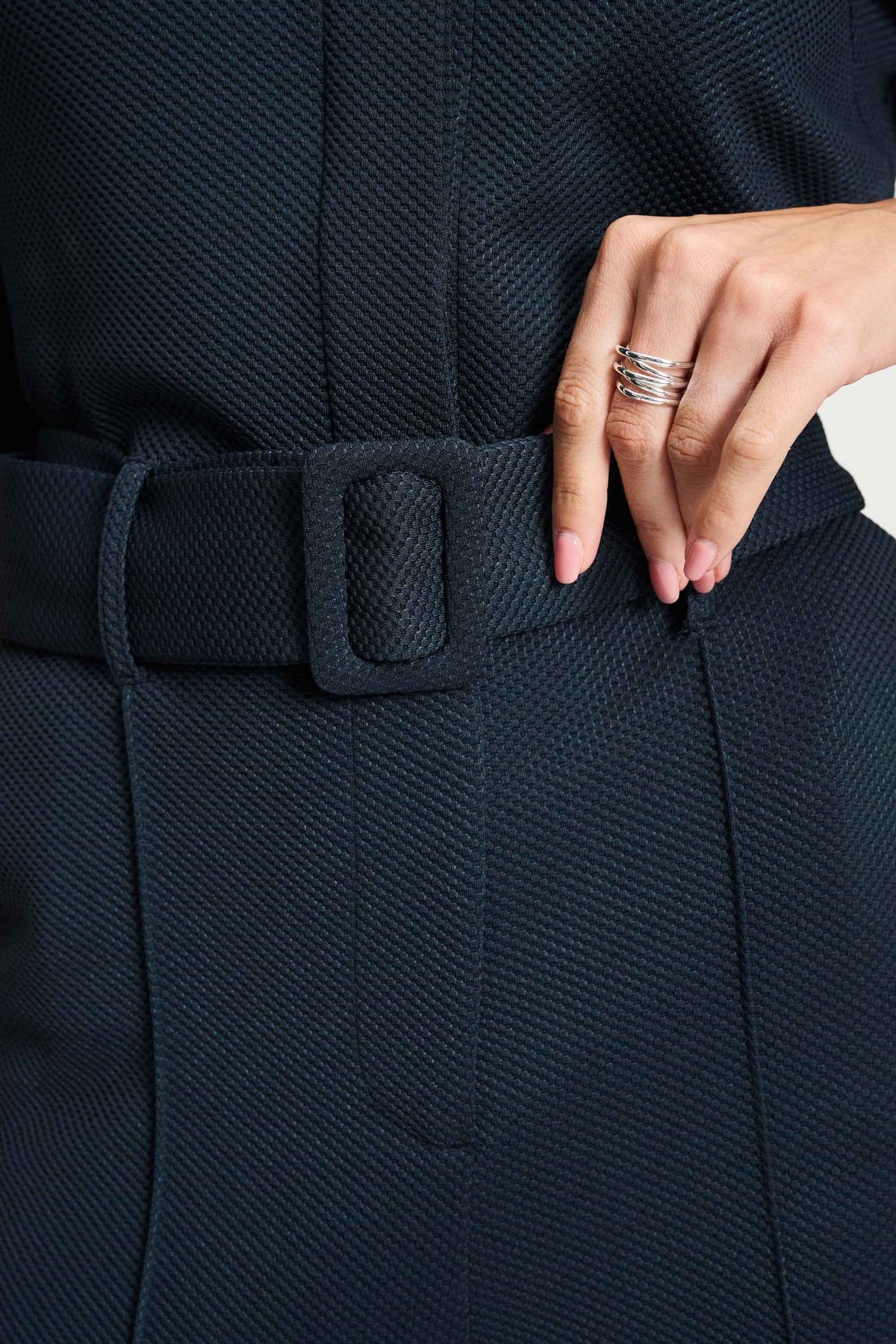 POM Amsterdam Megan jumpsuit in Eternal Blue, getoond op een model met lange mouwen en wijde pijpen.