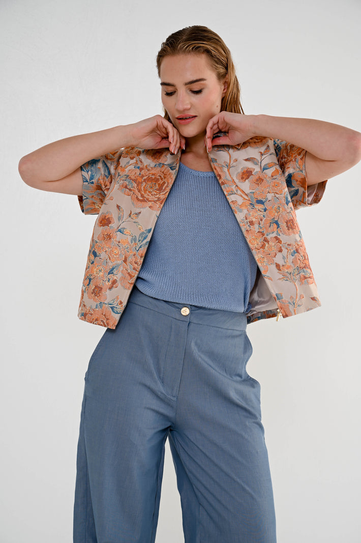 Oranje terry jas van Maicazz & Zizo, zomerse casual jacket met capuchon en ritssluiting, zichtbaar op de afbeelding.