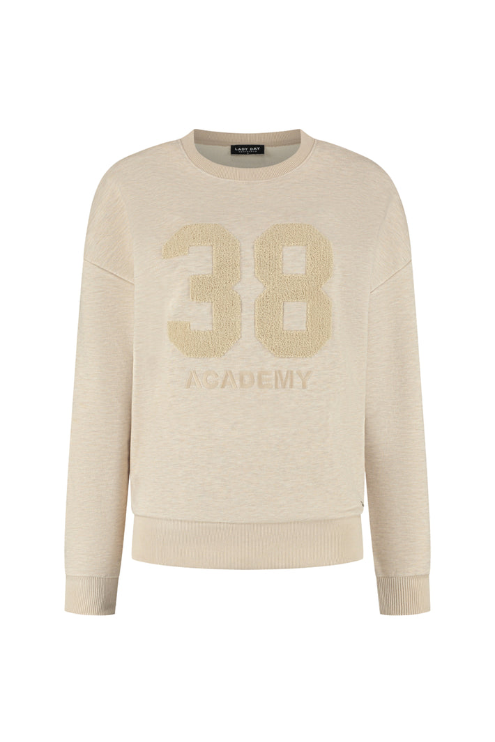 Lady Day trui Academy Vanilla Melange met zachte stof en ronde hals, close-up van de textuur en kleur.