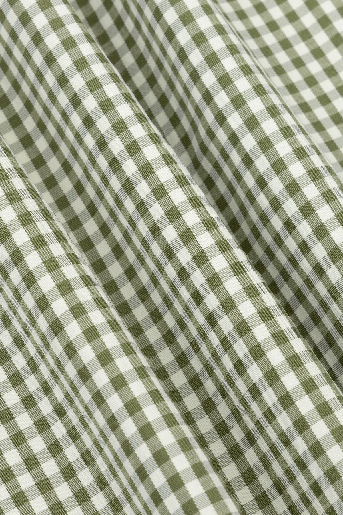 Groene geruite Ydence Jette gilet met knopen en zachte stof, gedragen door een persoon.